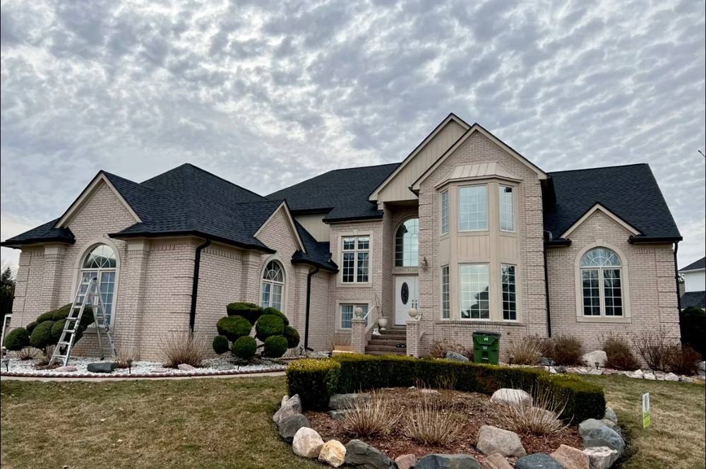 Completed gutter and fascia installation on a large residential home in Michigan