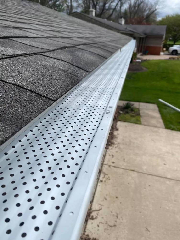 Close-up of professionally installed gutter guard system
